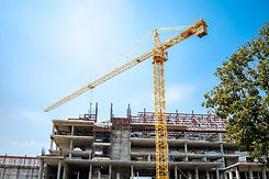 the-site-is-under-construction-a-large-building-with-a-yellow-crane.jpg