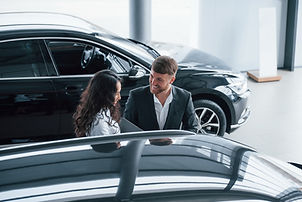 charming-young-people-female-customer-modern-stylish-bearded-businessman-automobile-saloon