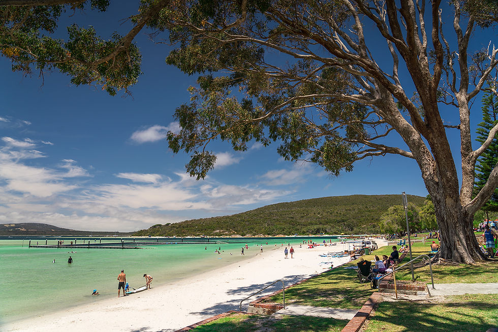 Close-up view of Emu Point's sandy beach with calm waters