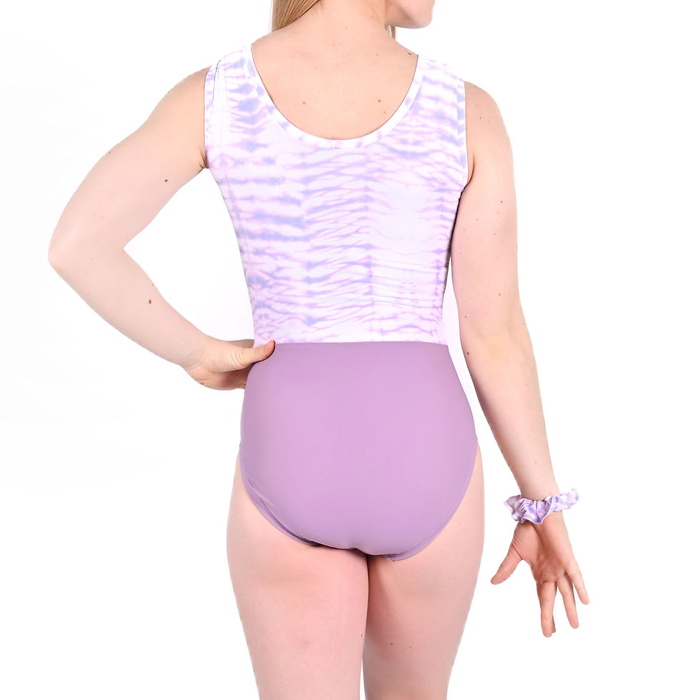 Gymnastics leotard in Switch Split style featuring a lavender “Lavender Latte” printed lycra upper with a contrasting lower b