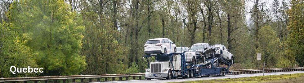 Car hauler convoy on Quebec Highway transporting a vehicle from Montreal to Vancouver