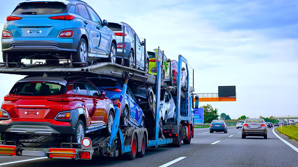 open car hauler highway carrying cars.jpg