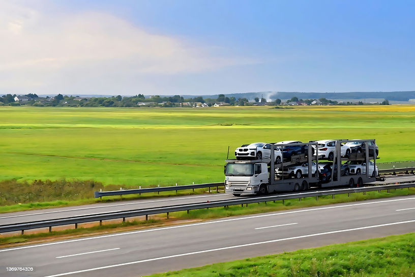 Car carrier truck loaded with vehicles for safe car shipping from Alberta to Ontario