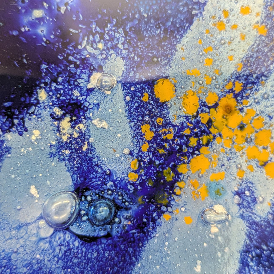Abstract art with blue, yellow and white colors and textures.