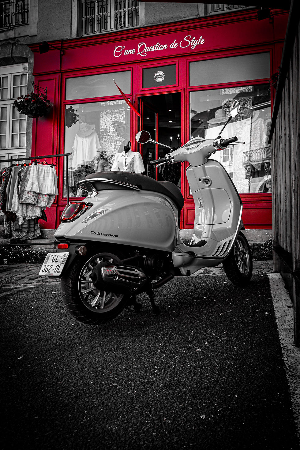 Not quite monochrome.....I was drawn to the muted foreground colours contrasting with the red of the paintwork on the rather appropriately names shop and accentuated the contrast