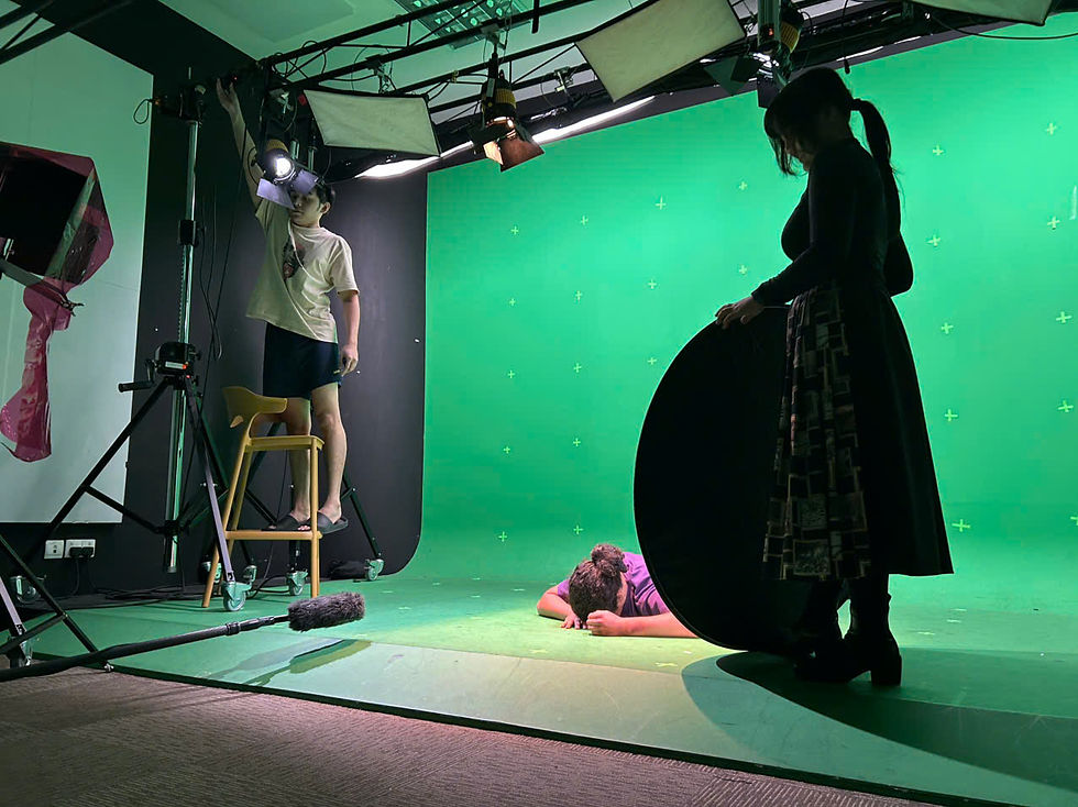 Lynn holding the reflector while Clarence adjusted the lights