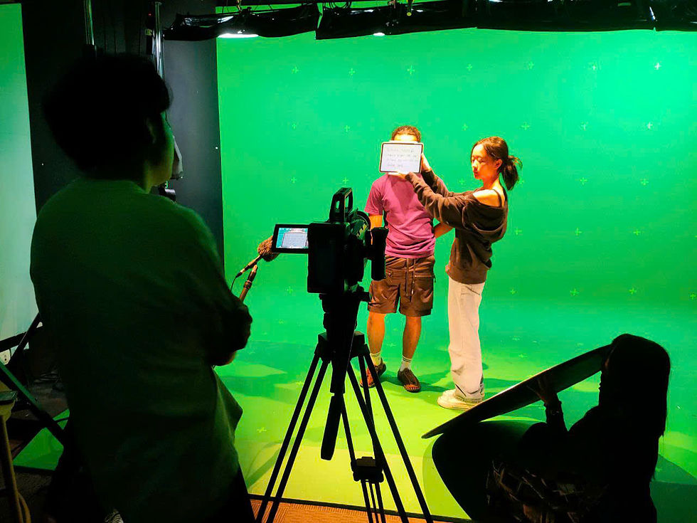Kay holding the slate in front of actor