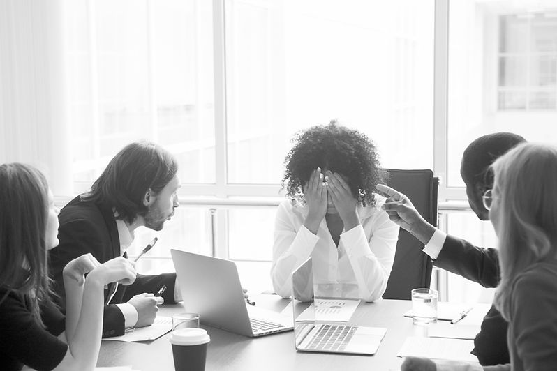 Rude diverse colleagues humiliating offending stressed upset young african woman leader su
