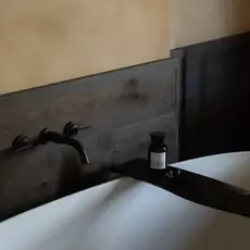 Wall Mounted Bath Taps in weathered bronze by Studio Ore