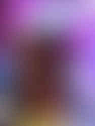 Dark illustrated hardcover featuring a woman with long black hair and blue eyes in the foreground, with a masked devil figure wearing horns and a cross-etched mask looming behind her against a black background.