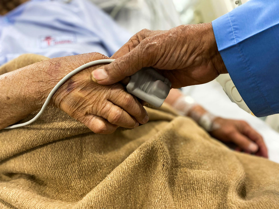 A senior man holding a senior womans hand.