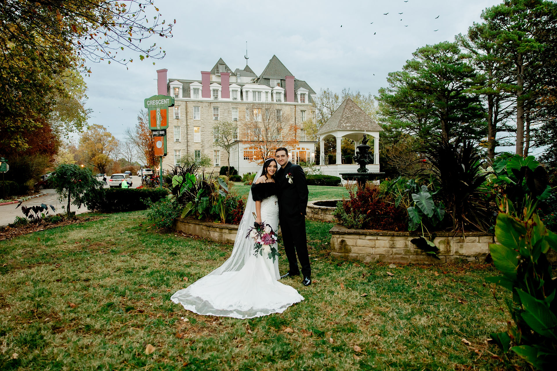 Elegant wedding portraits at Thorncrown Chapel in Eureka Springs