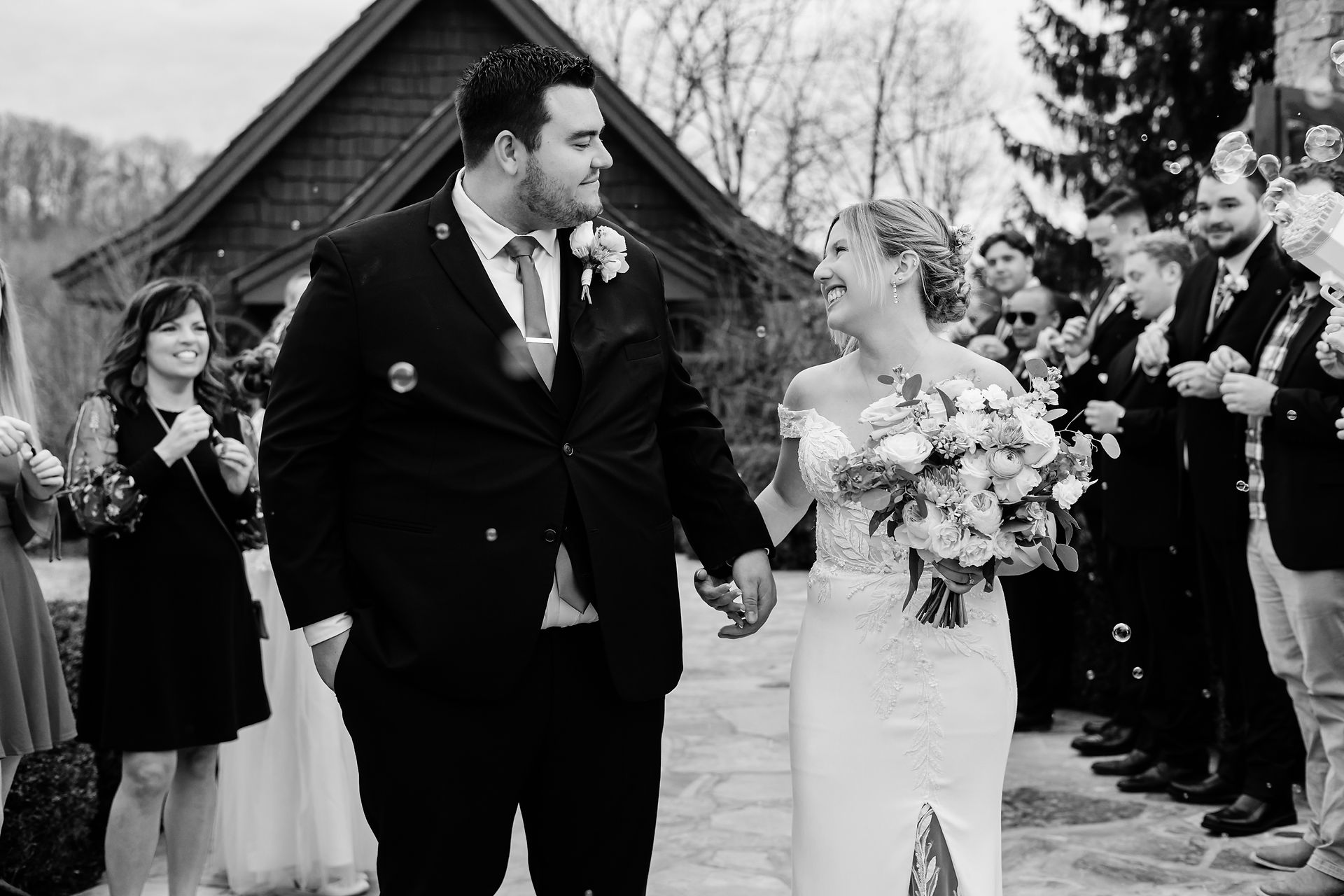 Bride and groom bubble exit outside chapel at Big Cedar Lodge