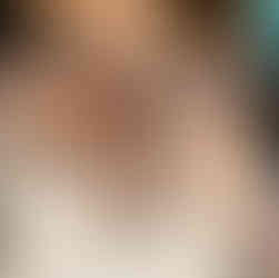 Bride’s tattoo and jeweled bouquet close-up