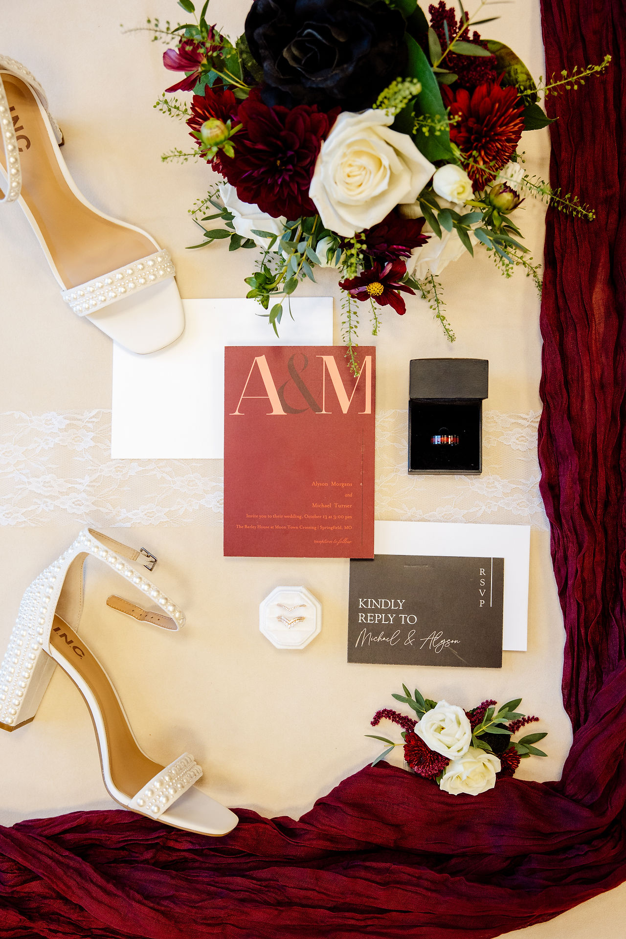 Wedding invitation flat lay with fall colors and floral details at a Springfield Missouri wedding