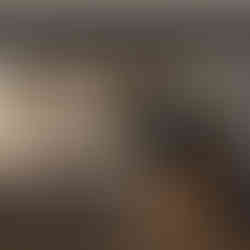 Kitchen with blue-gray walls and lower cabinets paired with white upper cabinets for a modern, balanced palette.