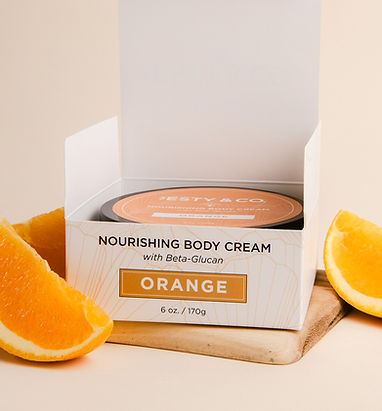 Body Cream open box with oranges_edited.jpg