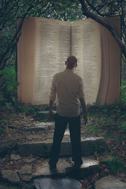 man with life size Bible