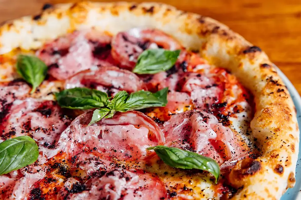 Neapolitan pizza topped with Tuscan finocchiona salami and basil at Massilia Bangkok