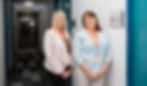Maxine and Judy standing inside the Access Ability Office]