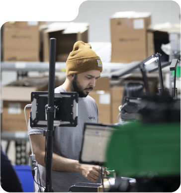 Focused worker uses computer system at the Spoke facility