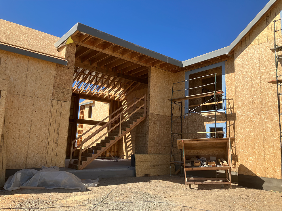 Luxury construction framing with stairs and scaffolding.
