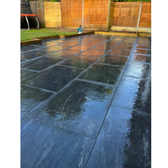 Dark porcelain patio installation in Northampton with large format slabs