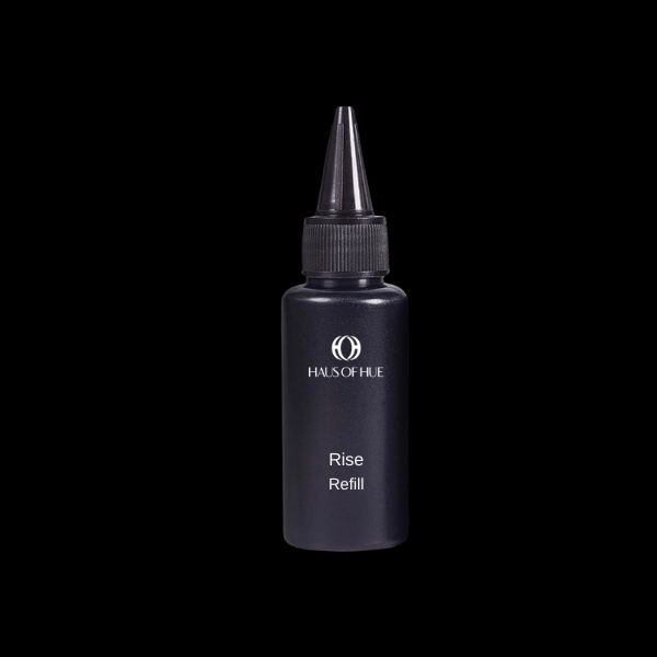 A sleek black bottle labeled "HAUS OF HUE Rise Refill." The bottle features a nozzle cap and is set against a dark black background, emphasizing its minimalist and modern design.