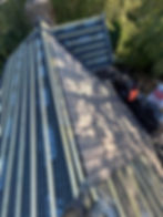 Local roofers installing a new roof with shingles and underlayment