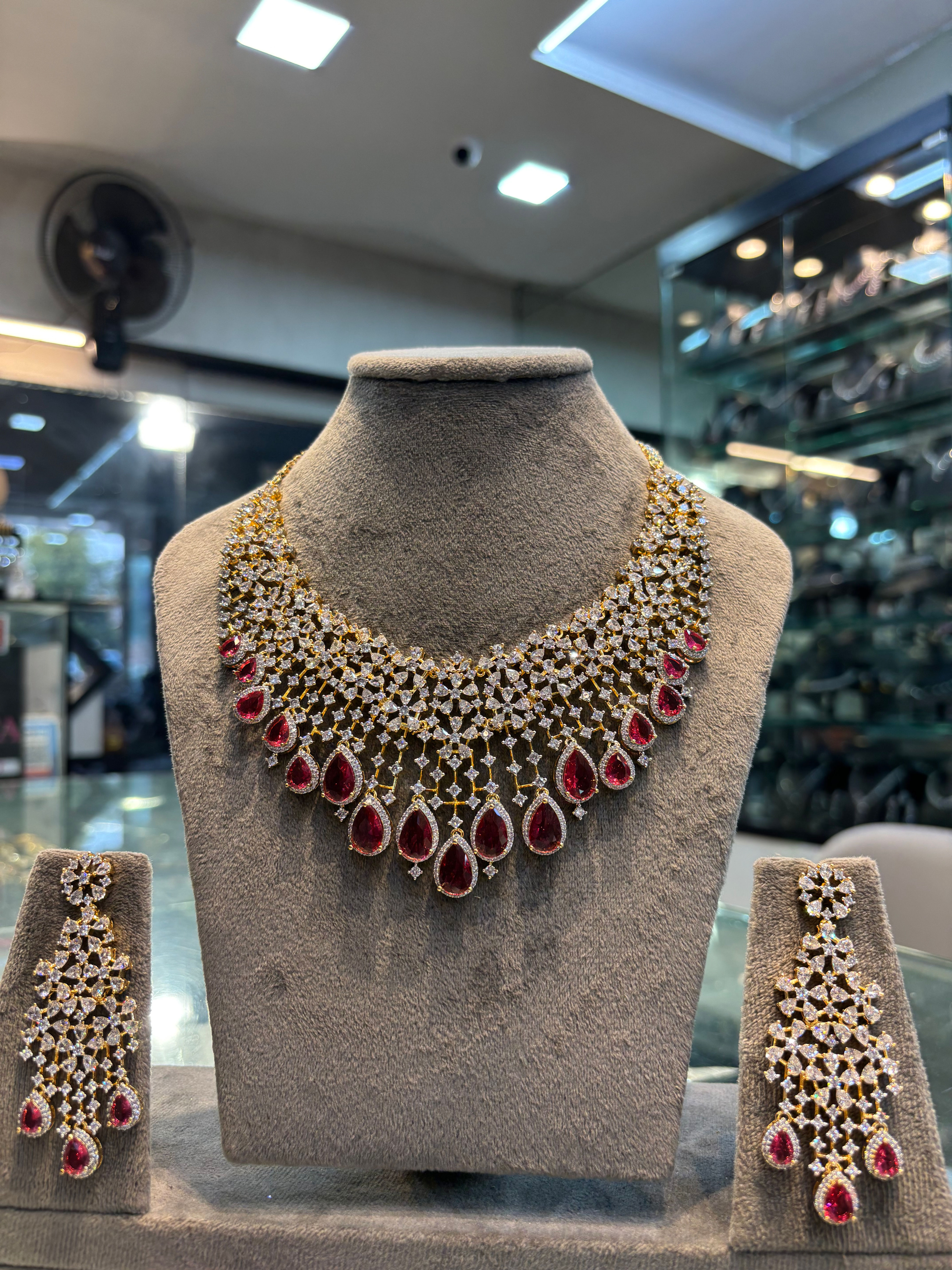 Real looking diamond studded necklace with earrings in gold polish - Red 