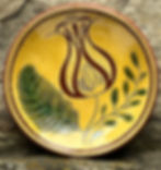 Pennsylvania German pottery known as Redware - sgraffito technique where the design is scratched thru the top layer of clay