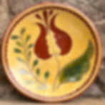 Redware plate with sgraffito design made in a 1760 circa stone house , Lehigh County, Pennsylvania