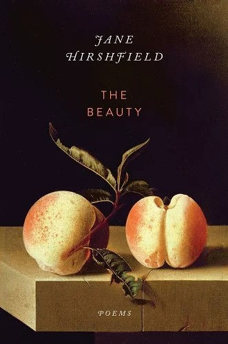 book cover with black background and two peaches on a table