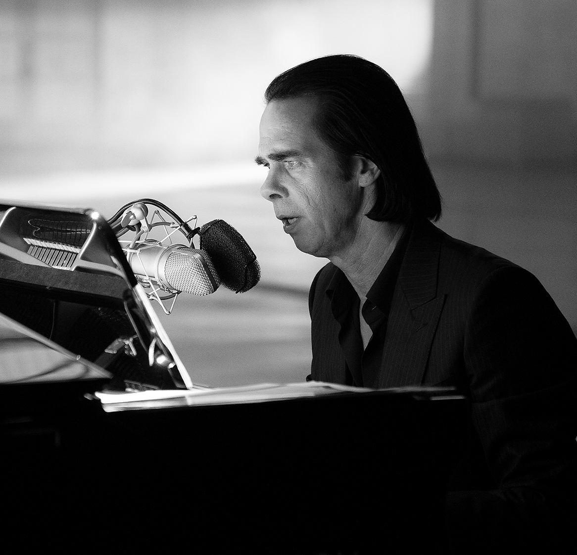 Man singing into a microphone