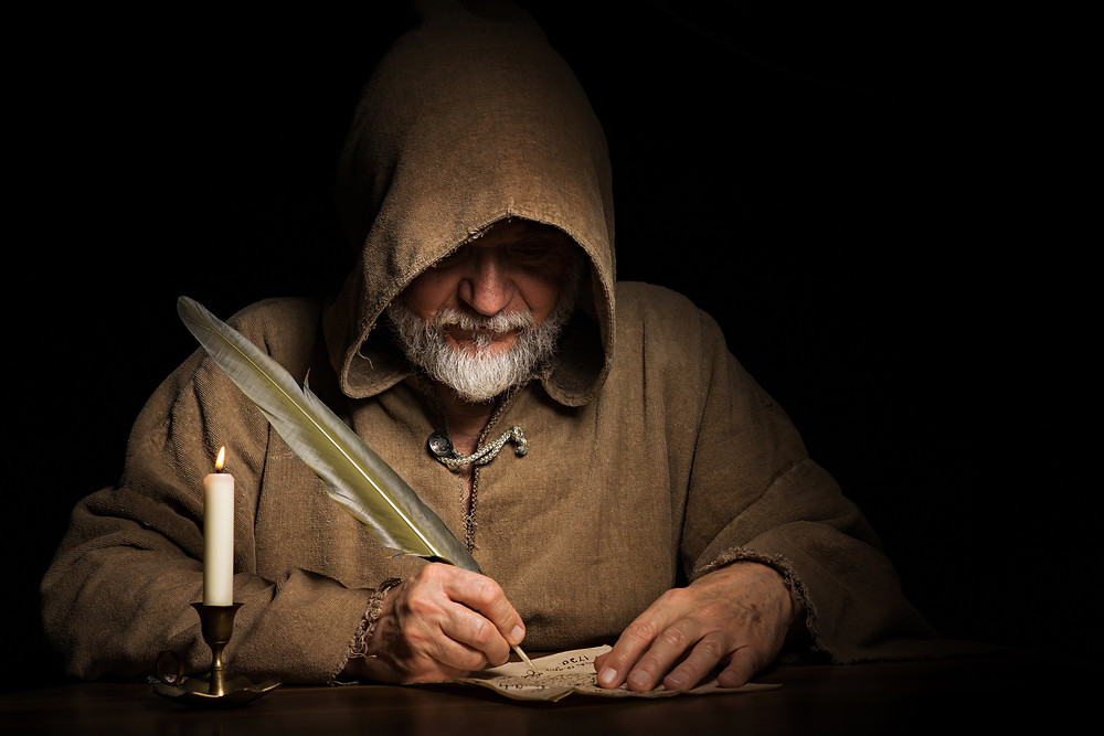 Monk writing.