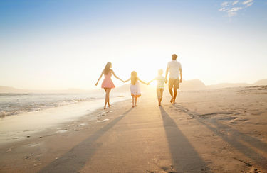 Family Walking On the Beach