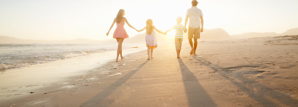 Family Walking On the Beach