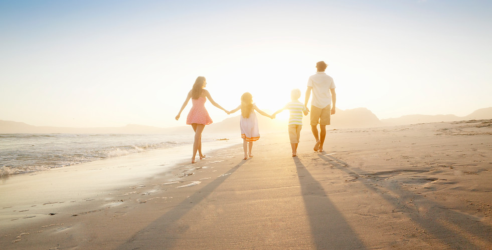 Family Walking On the Beach