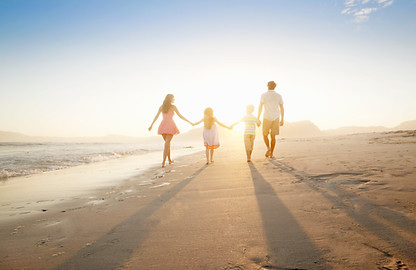 Family Walking On the Beach