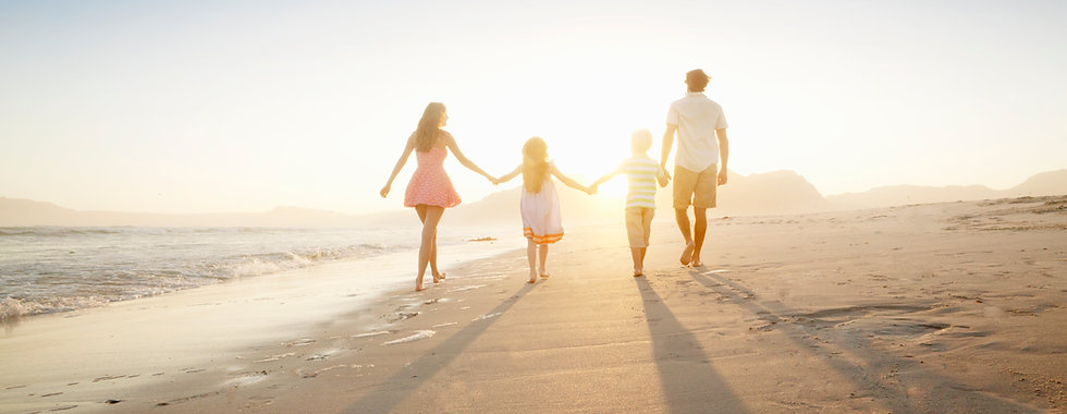 Family Walking On the Beach