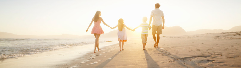 Family Walking On the Beach