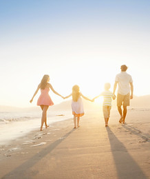 Family Walking On the Beach