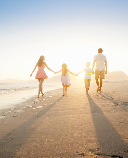 Family Walking On the Beach