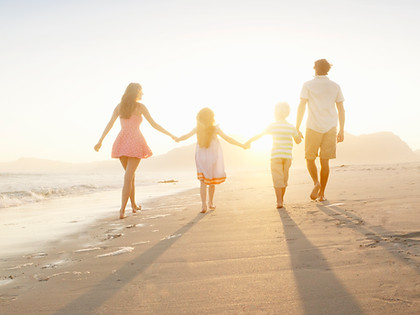 Family Walking On the Beach