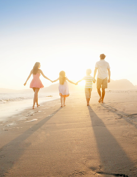 Family Walking On the Beach