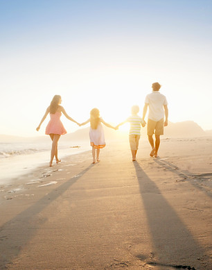 Family Walking On the Beach