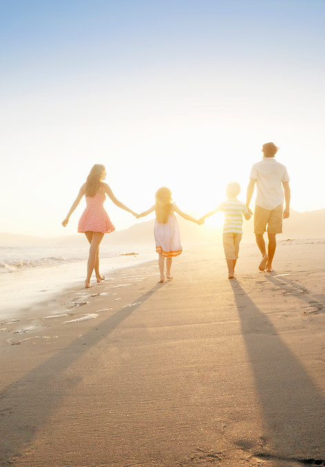 Family Walking On the Beach