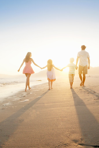 Family Walking On the Beach