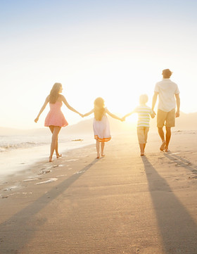 Family Walking On the Beach