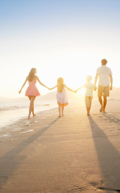 Family Walking On the Beach